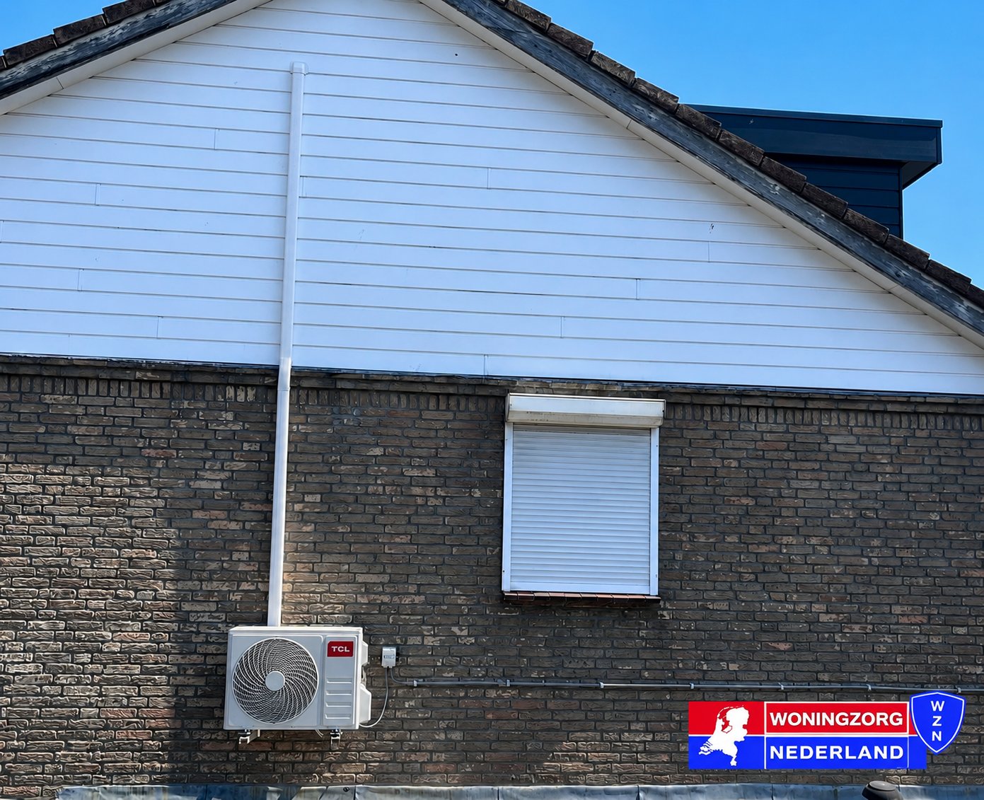 TCL buitenunit aan zijgevel woning